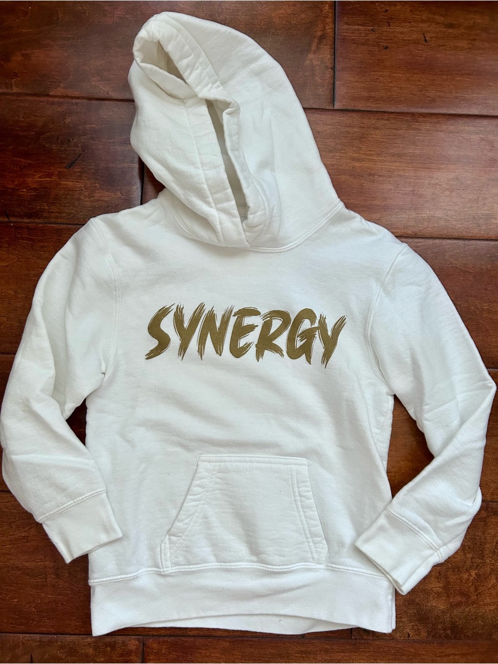 LIKE NEW Synergy white hooded sweatshirt - Youth Small with gold “Synergy”